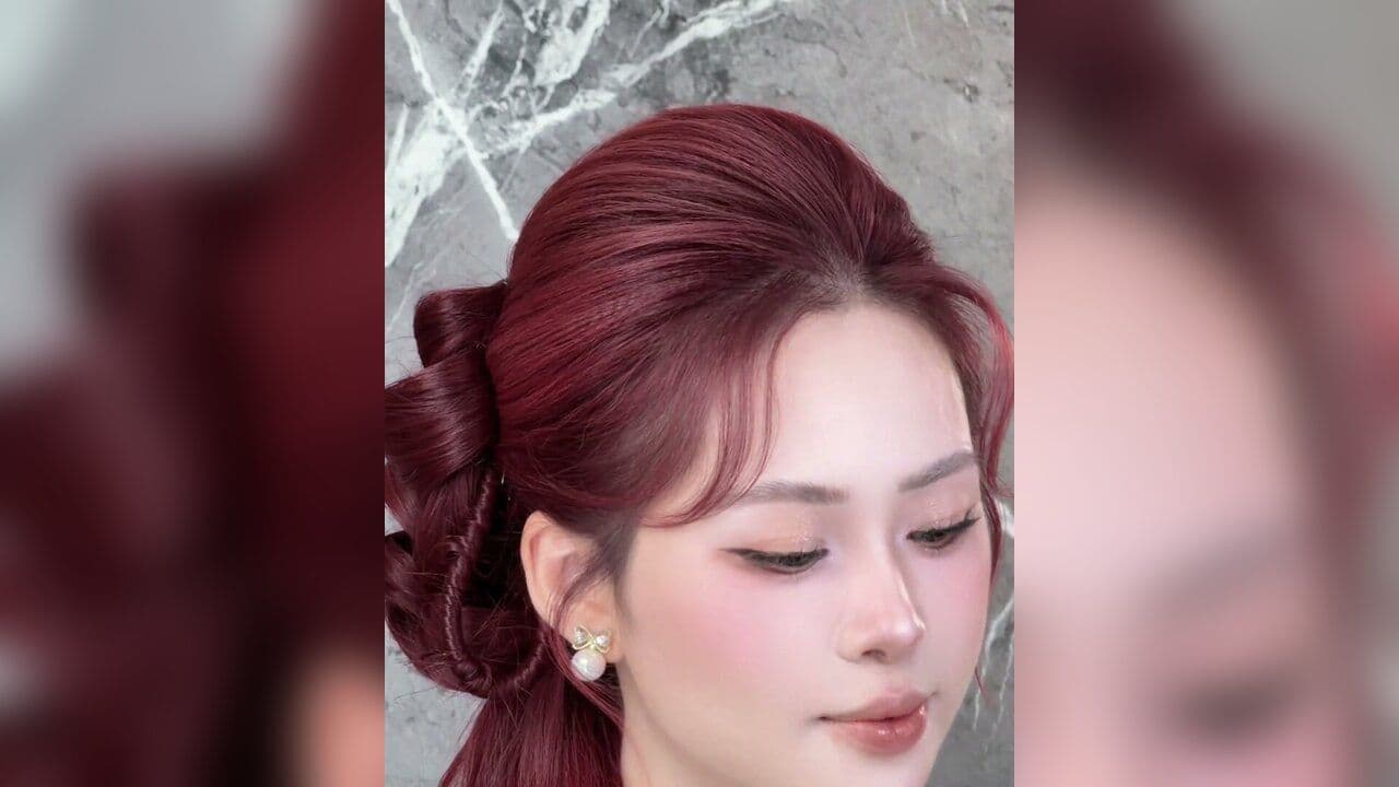 Kiểu tóc Búi lệch Á đông - mái phồng sợi bay